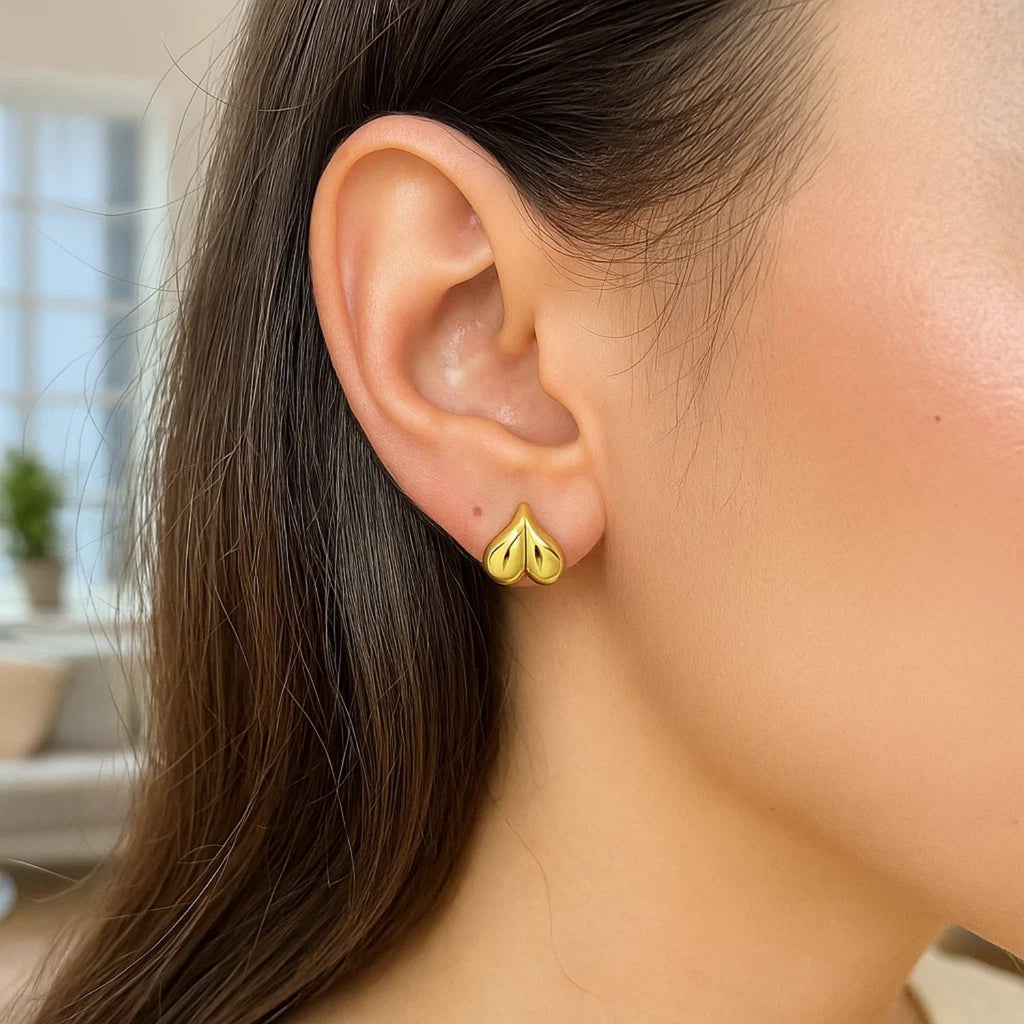 14K yellow gold puffed bubble heart stud earrings with modern design, perfect for elegant everyday wear.
