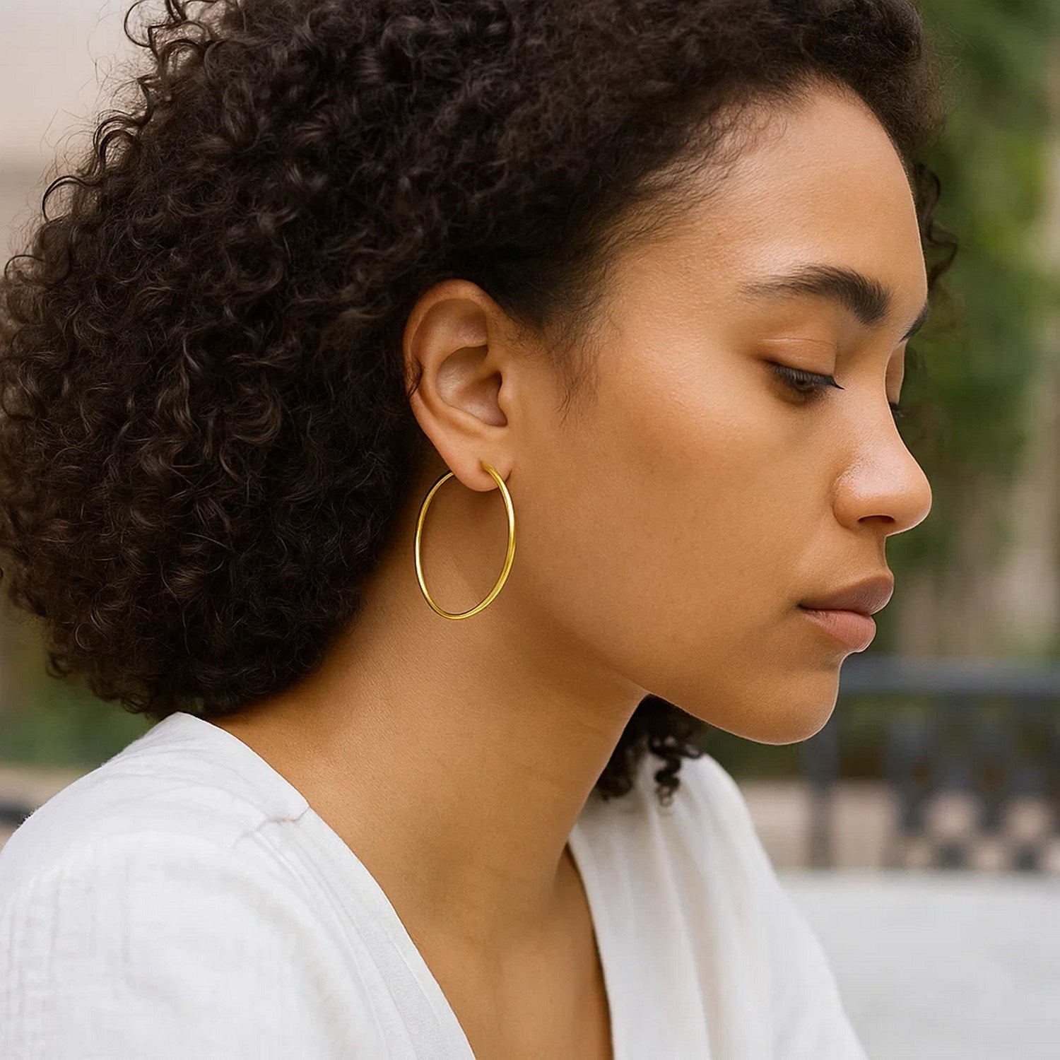 14k yellow gold modern endless hoop earrings showcasing a sleek, polished design for timeless elegance.