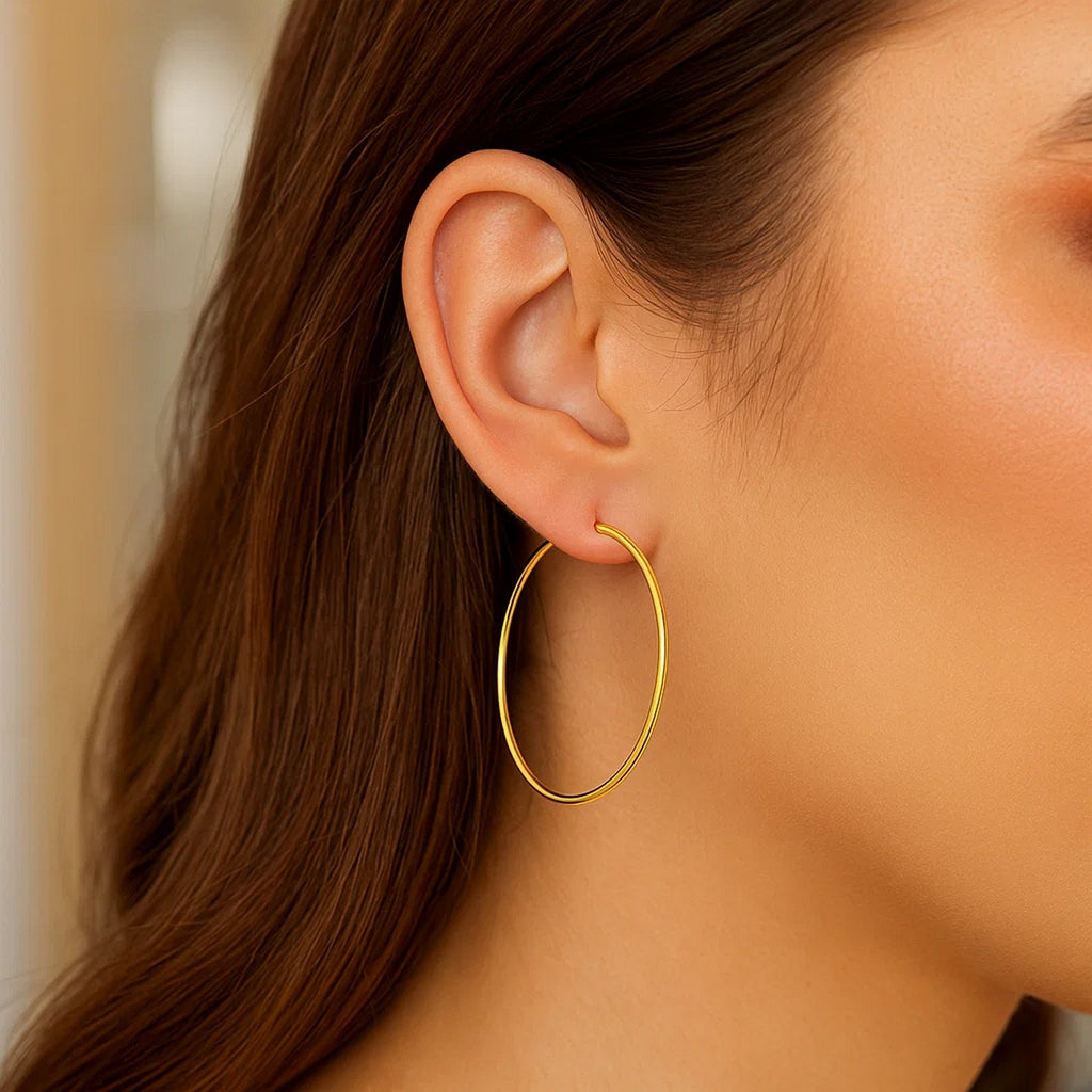14k yellow gold modern endless hoop earrings with a sleek, polished finish for a timeless elegance.
