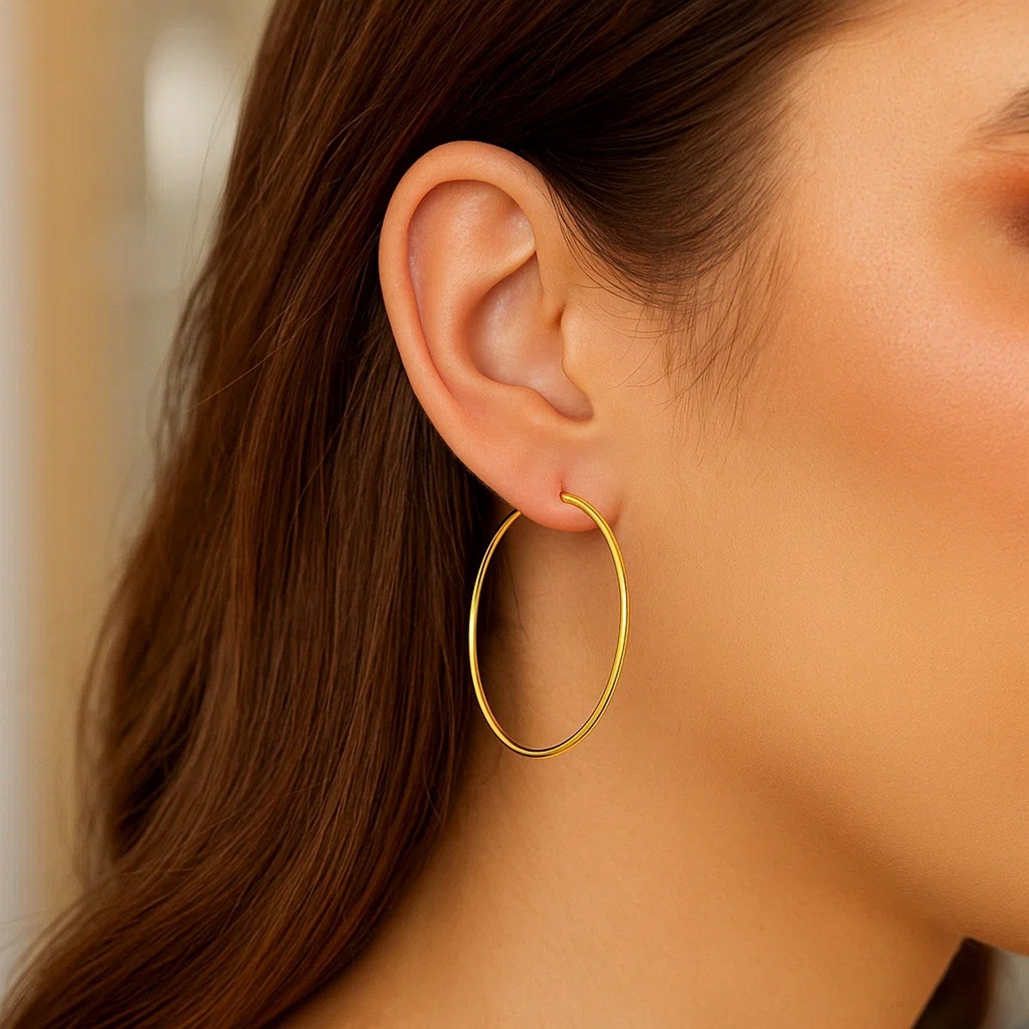 14k yellow gold modern endless hoop earrings with a sleek, polished finish for a timeless elegance.
