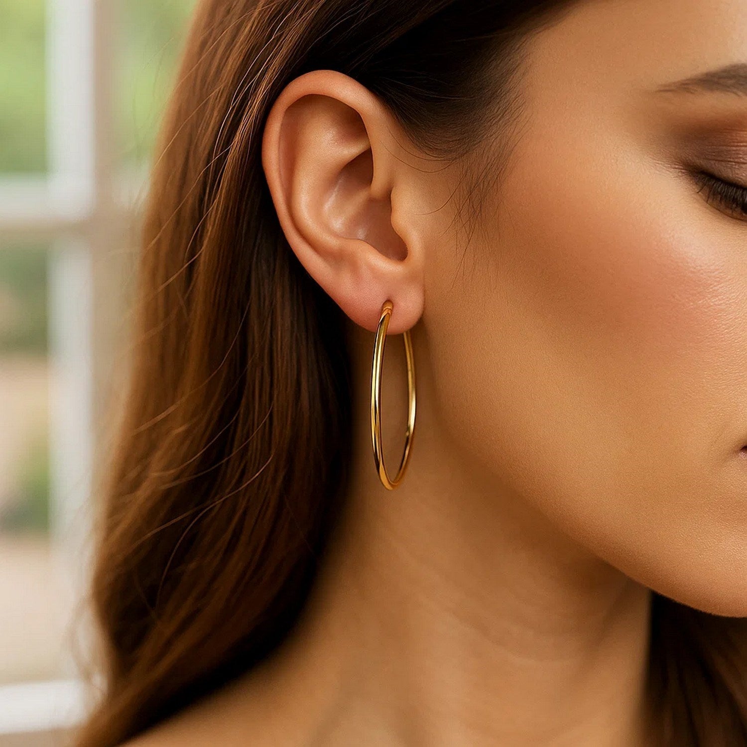 14k yellow gold modern endless hoop earrings showcasing a sleek, polished design for timeless elegance.