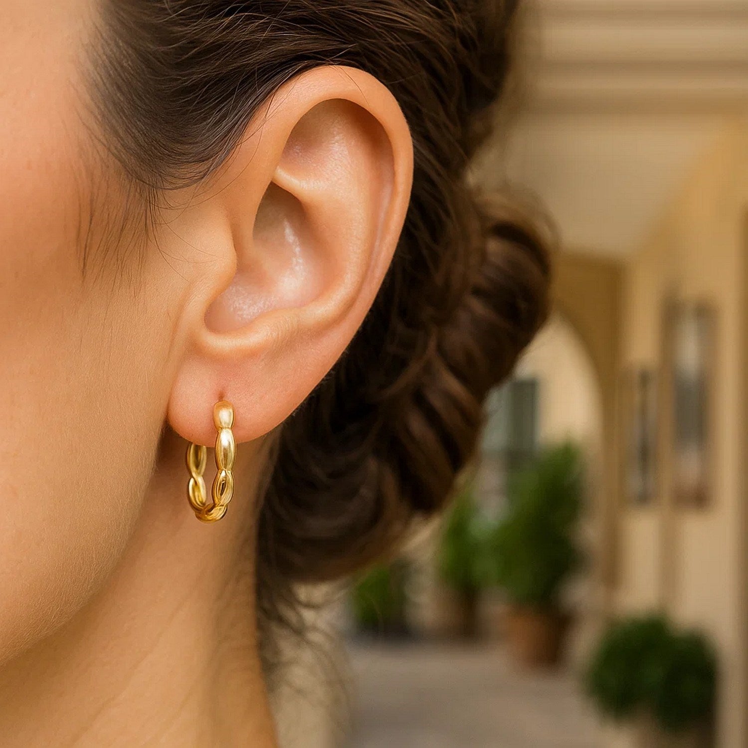 14k yellow gold medium rice hoop earrings with a sleek modern design, perfect for elegant everyday wear.