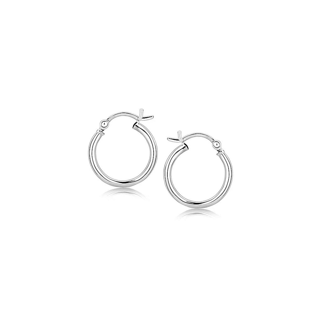 Polished sterling silver rhodium plated hoop earrings with an elegant design, perfect for sophisticated occasions.