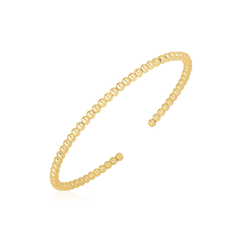 14k yellow gold high polish bead cuff bangle, modern design with luxurious shine, perfect for elegant stacking.