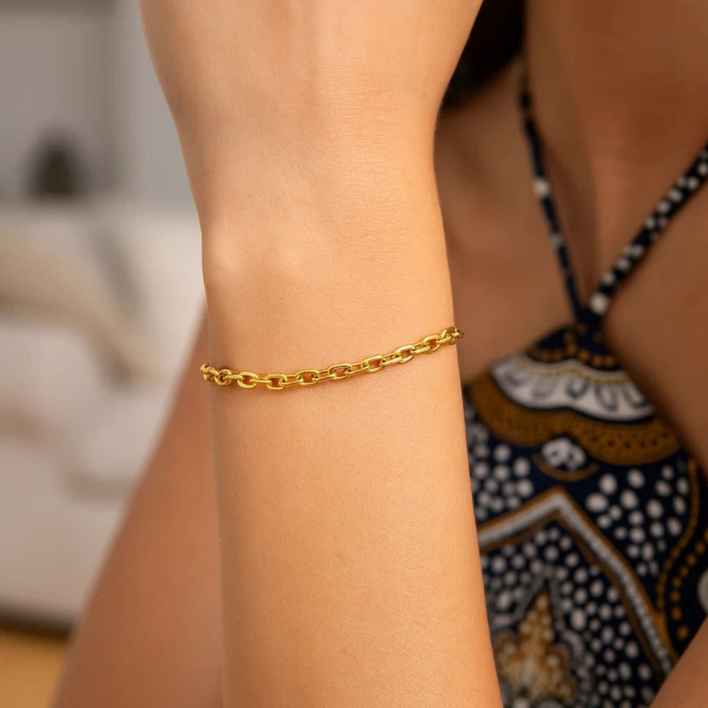 14k yellow gold minimalist cable chain bracelet showcasing elegant simplicity and timeless luxury.