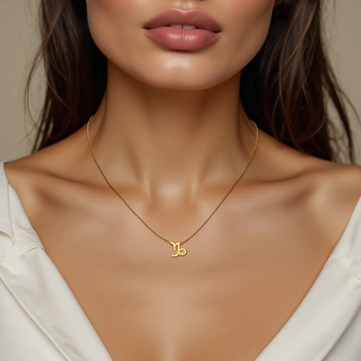 Elegant 14k yellow gold Capricorn necklace featuring a refined round stud design, perfect for sophisticated styling.