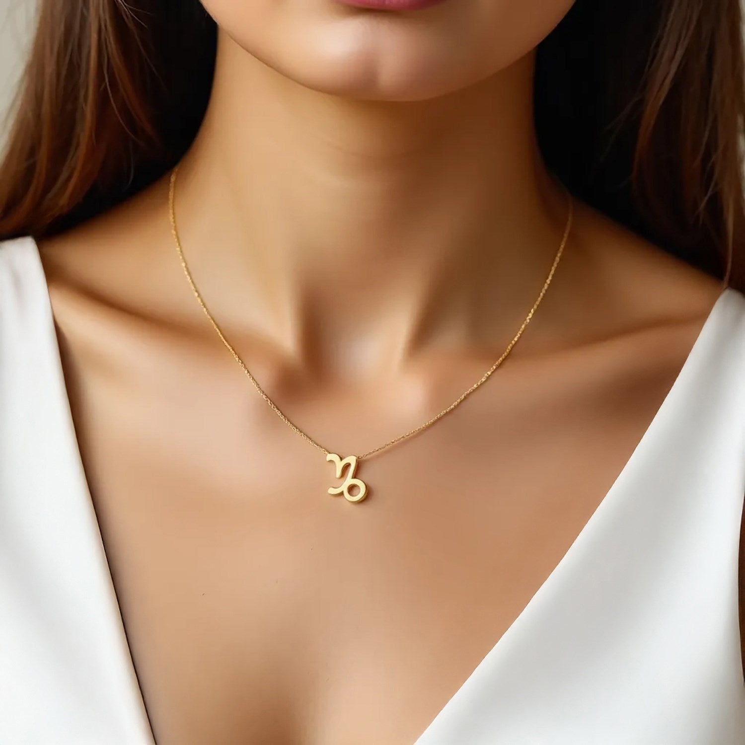 Elegant 14K yellow gold Capricorn necklace featuring a round stud design, perfect for sophisticated jewelry lovers.