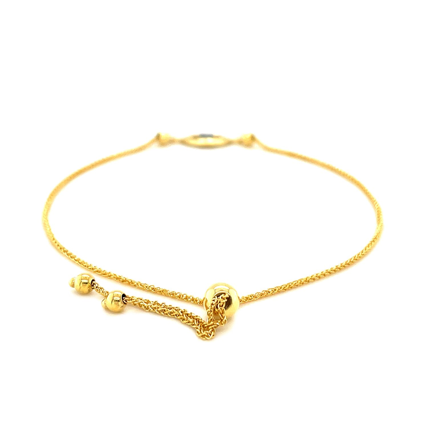 Elegant 14k yellow gold adjustable evil eye bracelet featuring a delicate chain design for a luxurious touch.