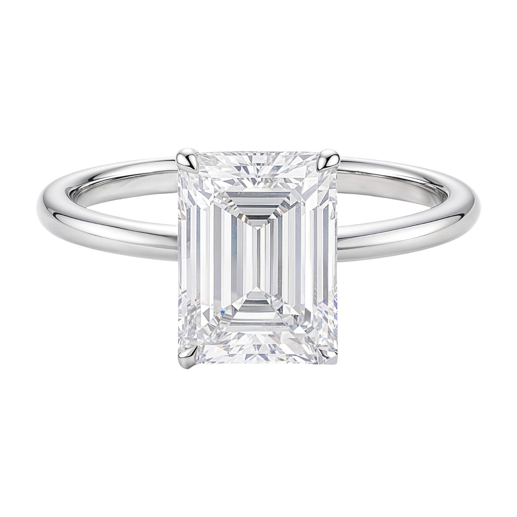 14k white gold solitaire ring featuring a 3 carat emerald and IGI G/VS1 diamond for a modern, elegant look.