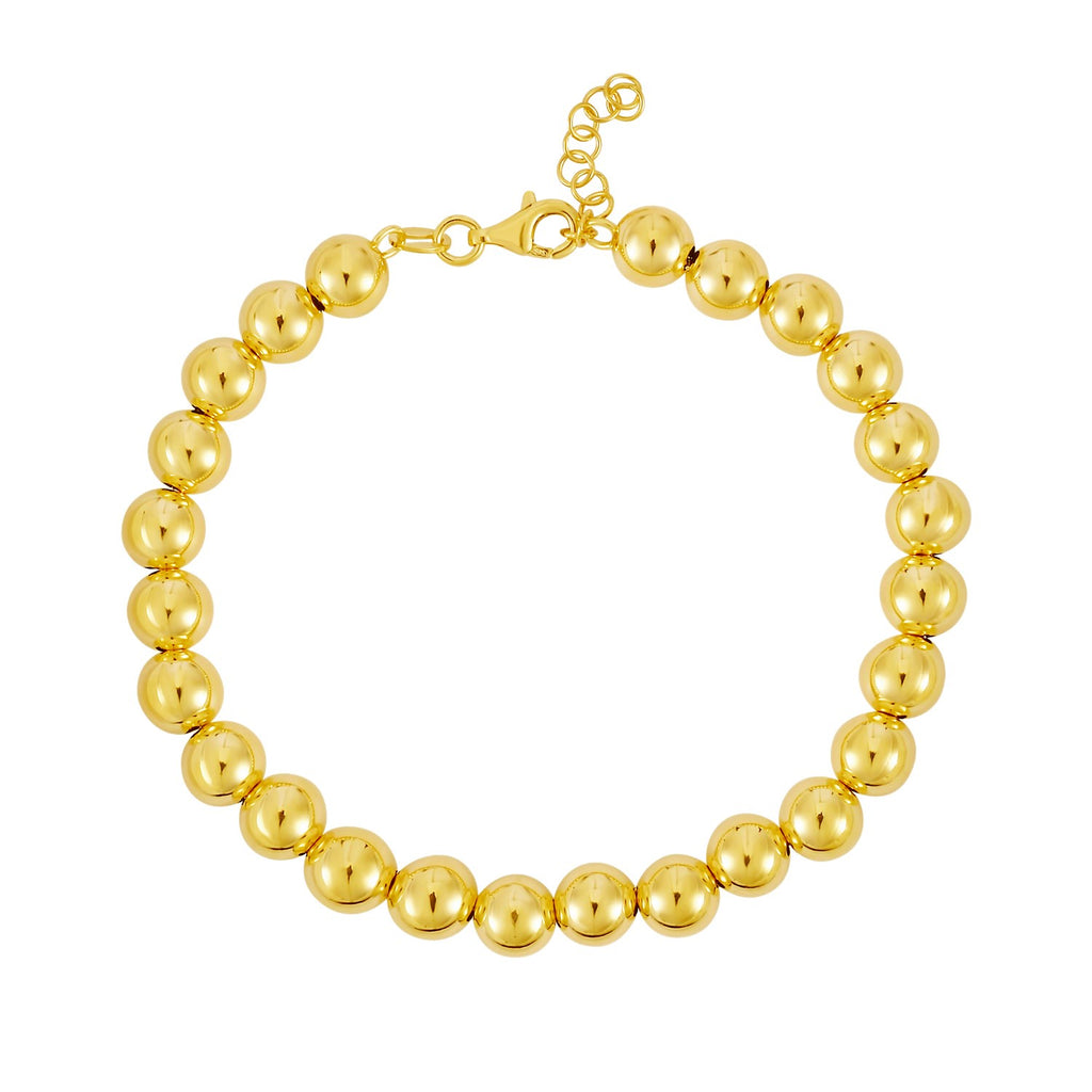 Polished 7mm bead bracelet in luxurious 14k yellow gold, showcasing minimalist elegance and timeless design.