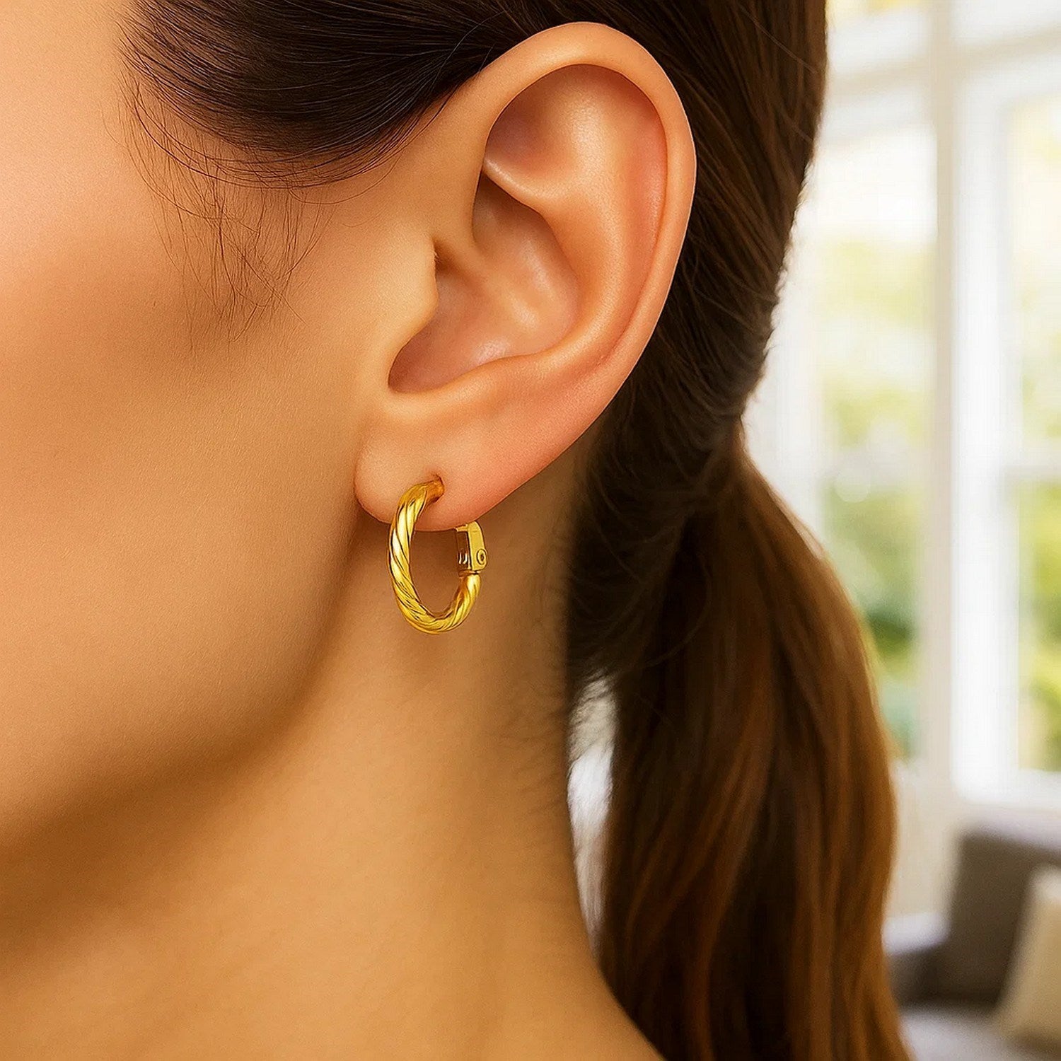 14k yellow gold petite twisted hoop earrings showcasing elegant design and refined craftsmanship for luxury style.