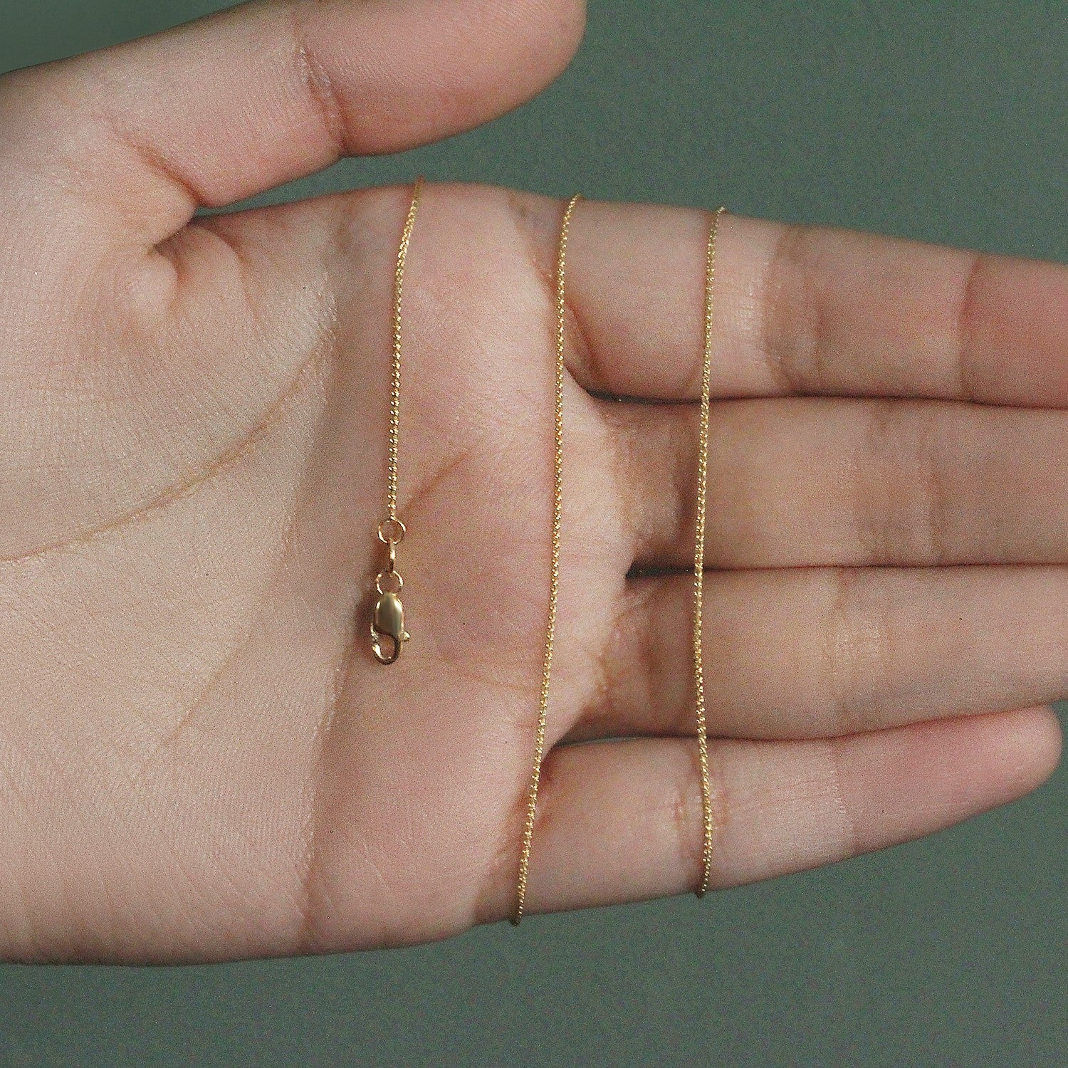 14k yellow gold round wheat chain, modern design, 0.80 mm thickness, perfect for layering or standalone elegance.