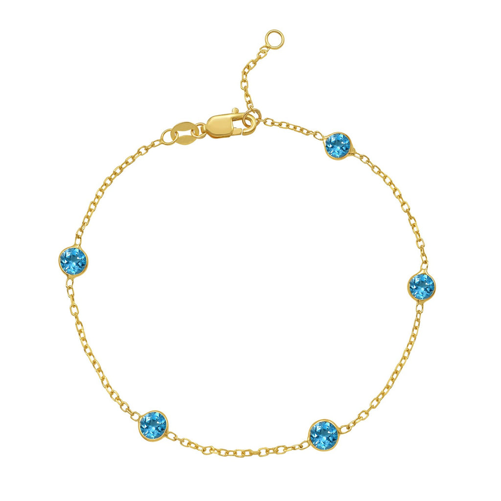 14k yellow gold contemporary bracelet featuring blue topaz stations along a delicate chain design.