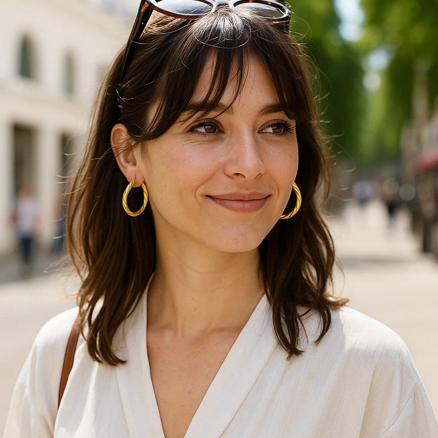 14k yellow gold textured large hoop earrings with a modern design, perfect for elegant occasions and everyday wear.