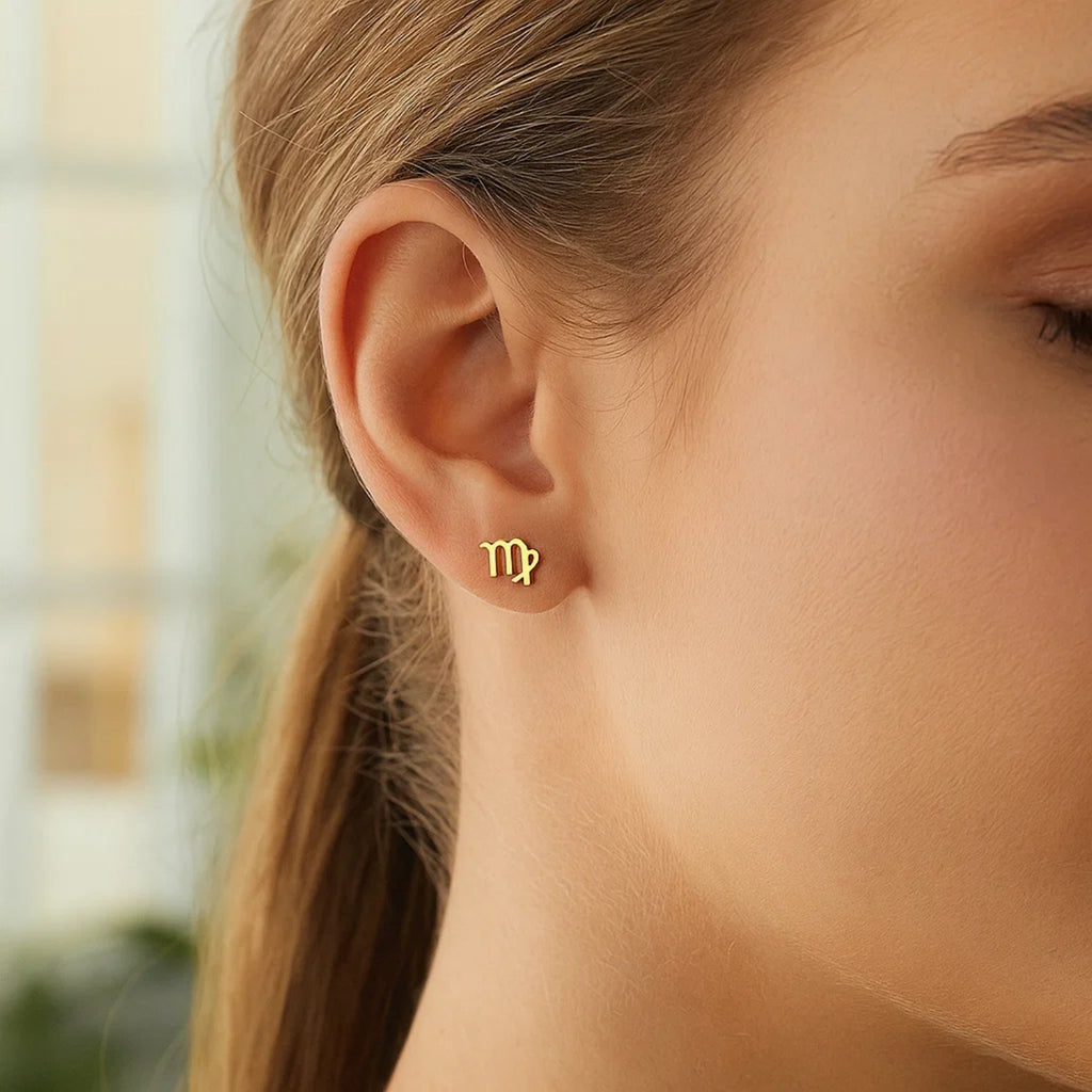 Minimalist 14k yellow gold stud earrings featuring a sleek design, perfect for elegant everyday wear.