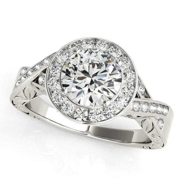 Halo set diamond engagement ring in 14k white gold featuring a stunning round center stone and modern design elegance.