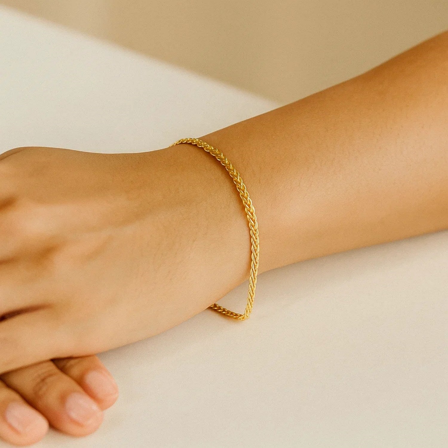 Classic 10k yellow gold wheat chain bracelet, 3.00 mm, showcasing timeless elegance and luxurious craftsmanship.