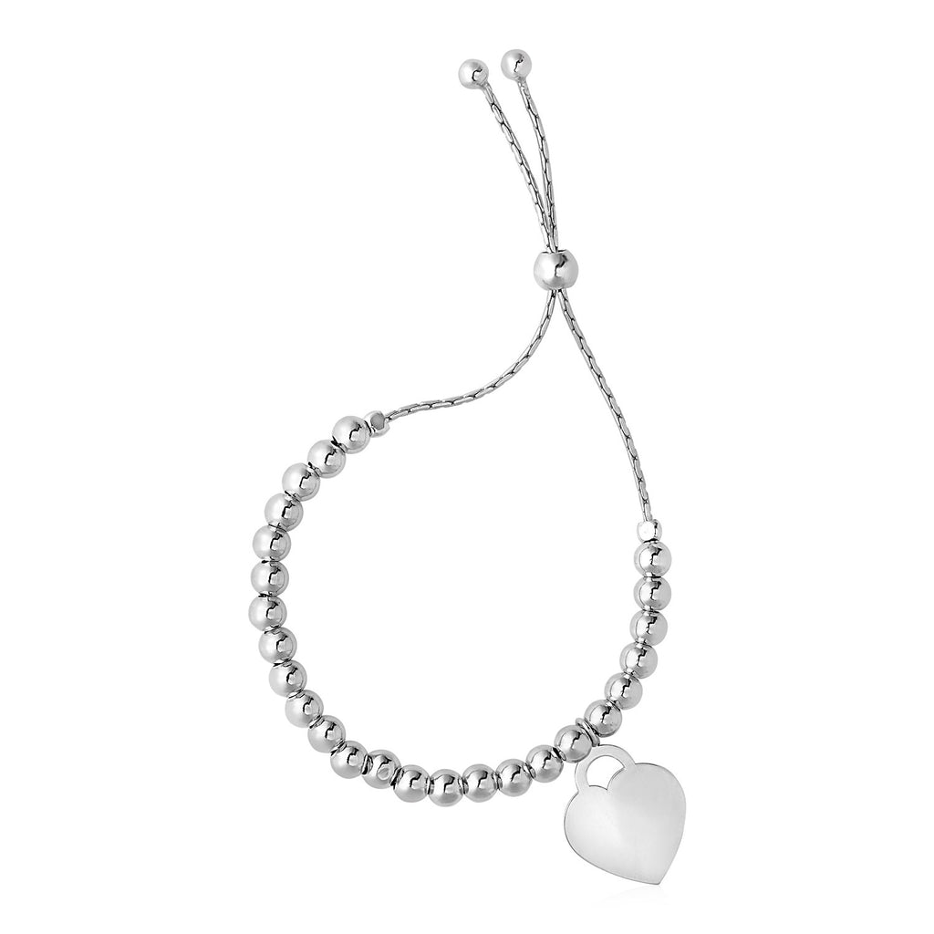 Adjustable sterling silver bracelet featuring shiny beads and a delicate heart charm, embodying modern elegance.