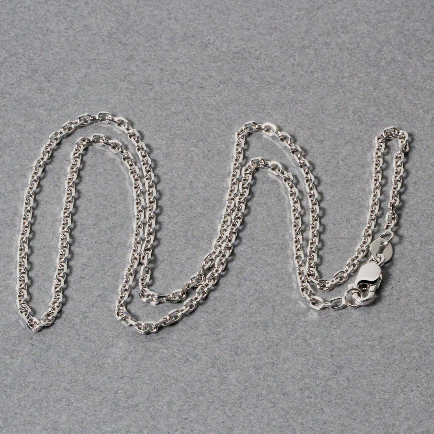 Elegant 18k white gold diamond cut cable link chain, 1.90 mm, showcasing exquisite craftsmanship and timeless style.