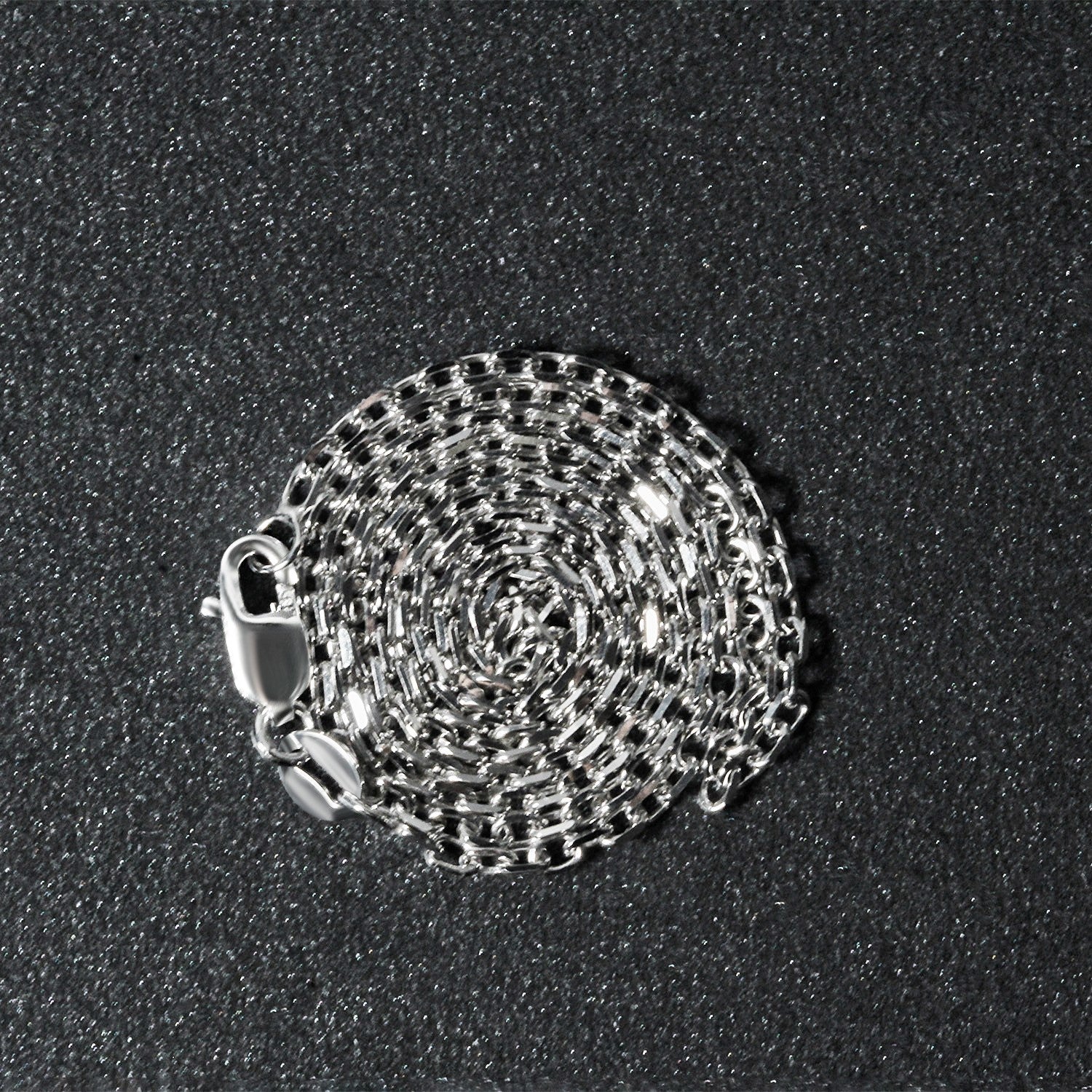 Elegant 18k white gold diamond cut cable link chain, 1.90 mm, showcasing exquisite craftsmanship and timeless style.