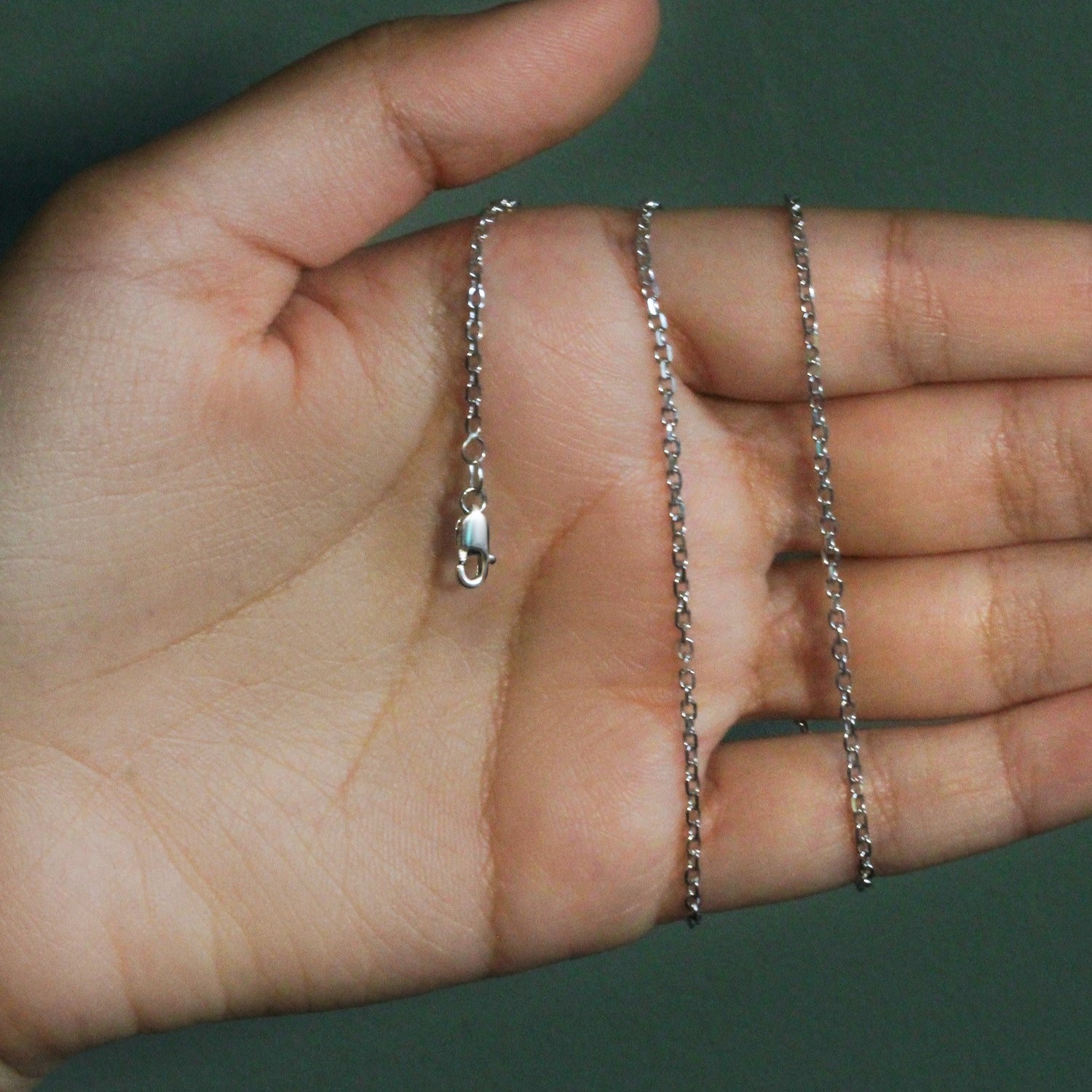 Elegant 18k white gold diamond cut cable link chain, 1.90 mm, showcasing a luxurious and timeless design.