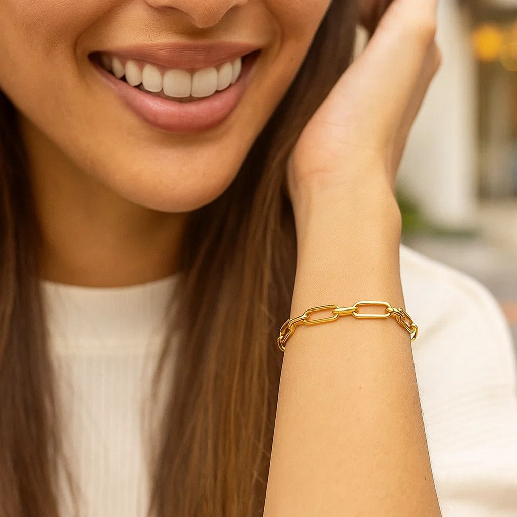 14k yellow gold Bombay paperclip chain bracelet, modern design with elegant links, 7 1/4 inches long.