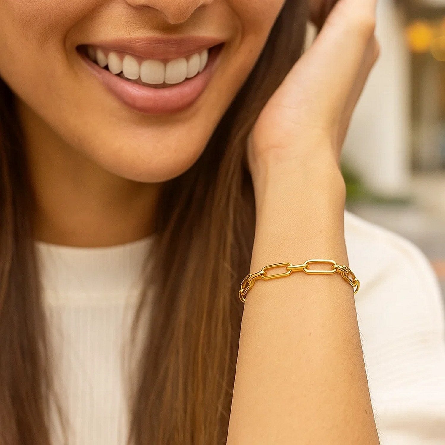 14k yellow gold Bombay paperclip chain bracelet, modern design with elegant links, 7 1/4 inches long.