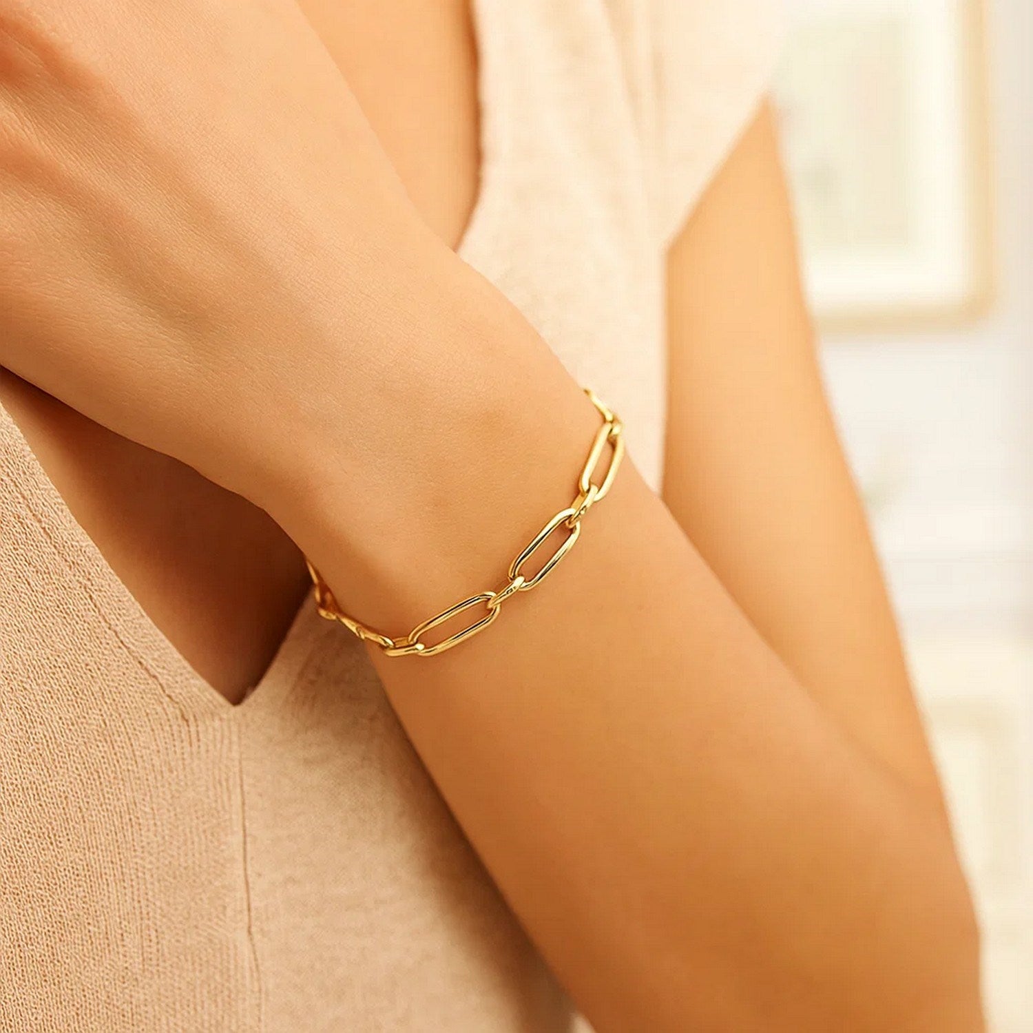 14k yellow gold Bombay paperclip chain bracelet, modern design, 7 1/4 inches, featuring elegant link details.