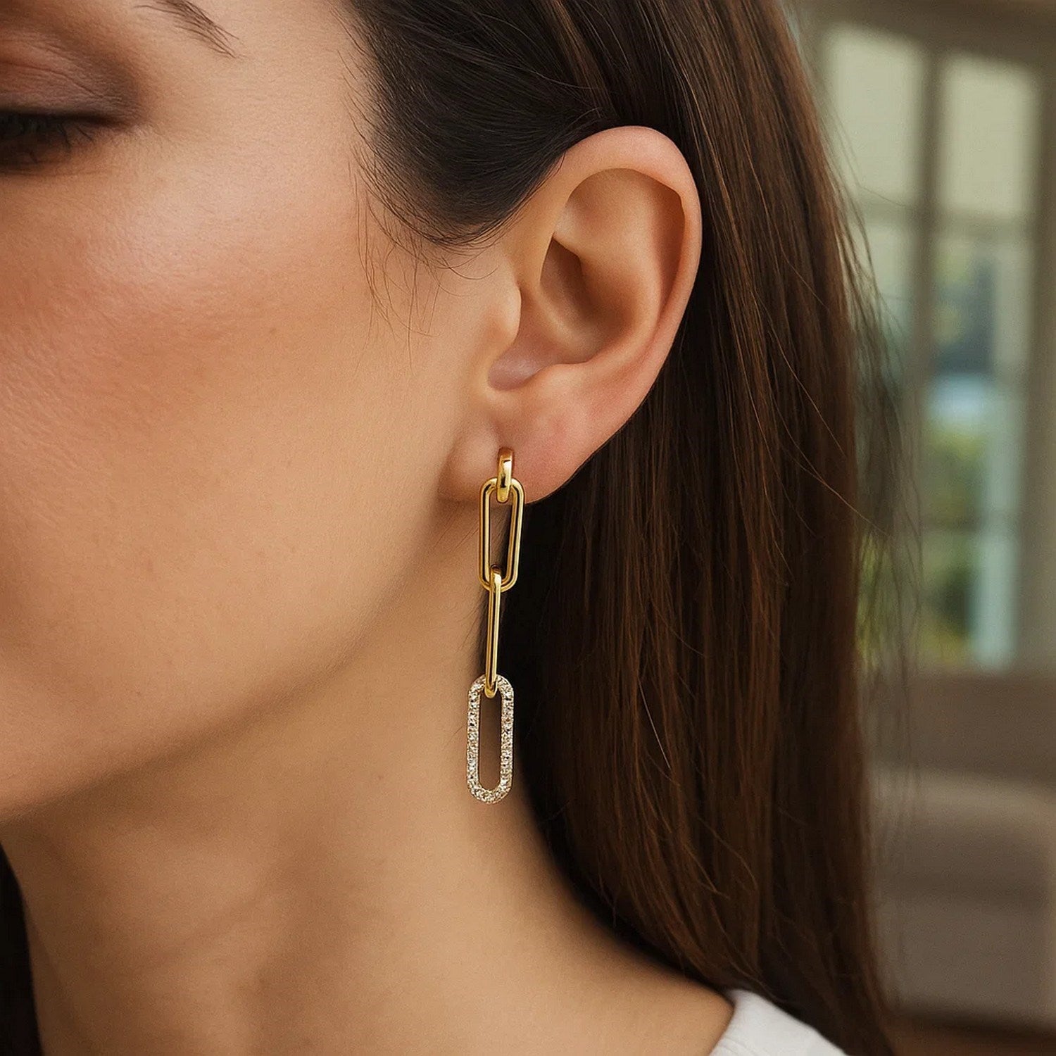 14k yellow gold dangle earrings featuring a modern paperclip chain design adorned with sparkling diamonds.