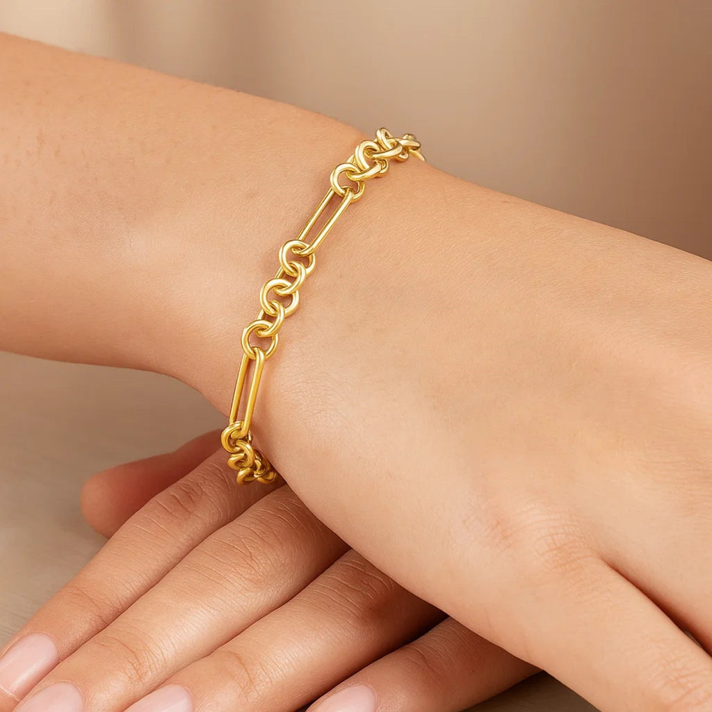 14k yellow gold modern paperclip link bracelet showcasing elegant chain design and luxurious shine.