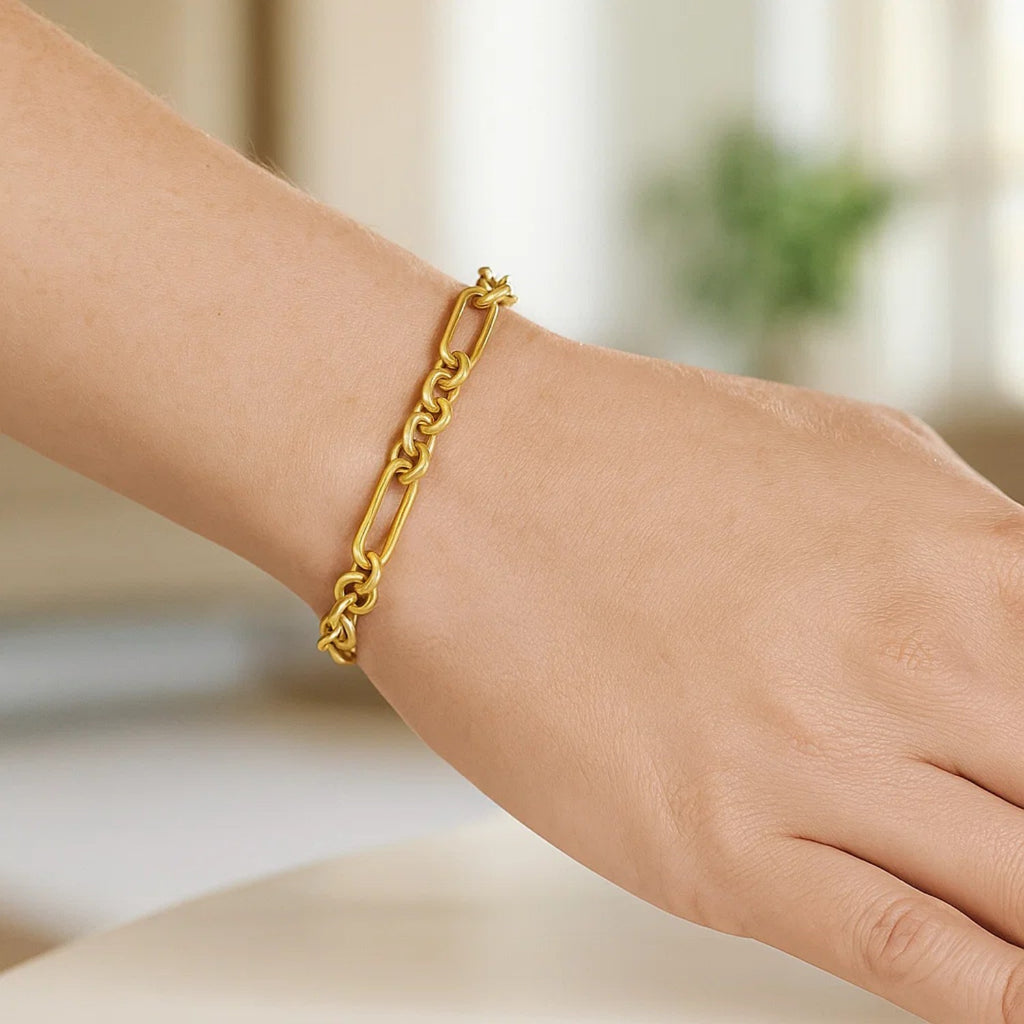 14k yellow gold modern paperclip link bracelet showcasing elegant chain design and luxurious shine.