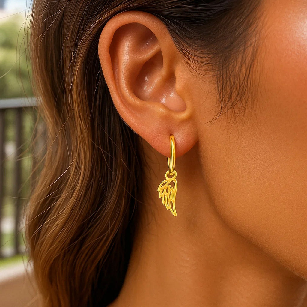 14k yellow gold hoop earrings featuring elegant angel wing design for a contemporary, luxurious look.