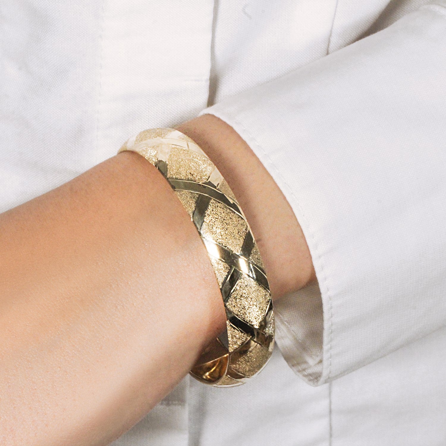10k yellow gold dual-textured bangle featuring a luxurious diamond pattern, modern design, and 12.00 mm width.