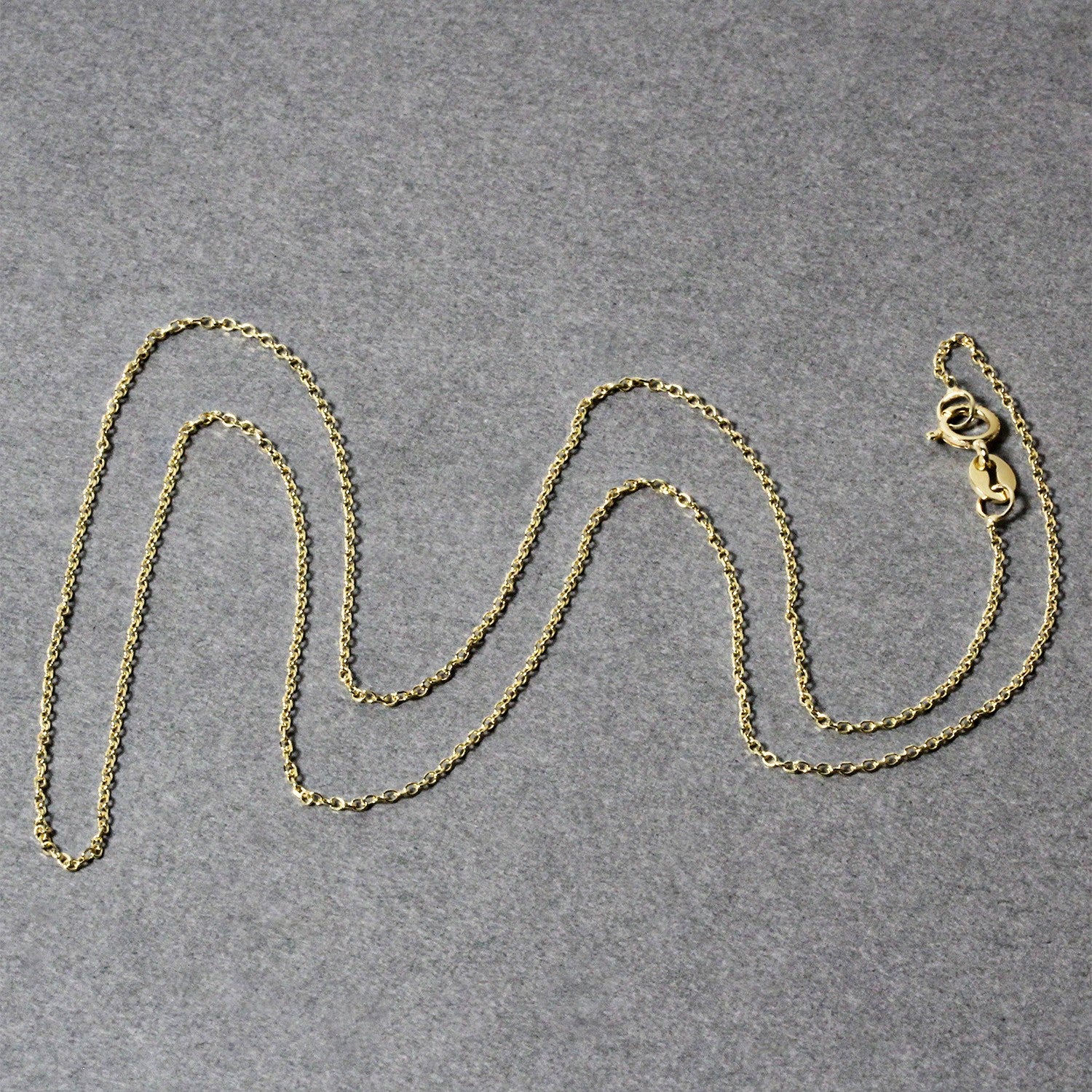 14k yellow gold diamond cut cable link chain, modern design with elegant links, perfect for layering or standalone wear.