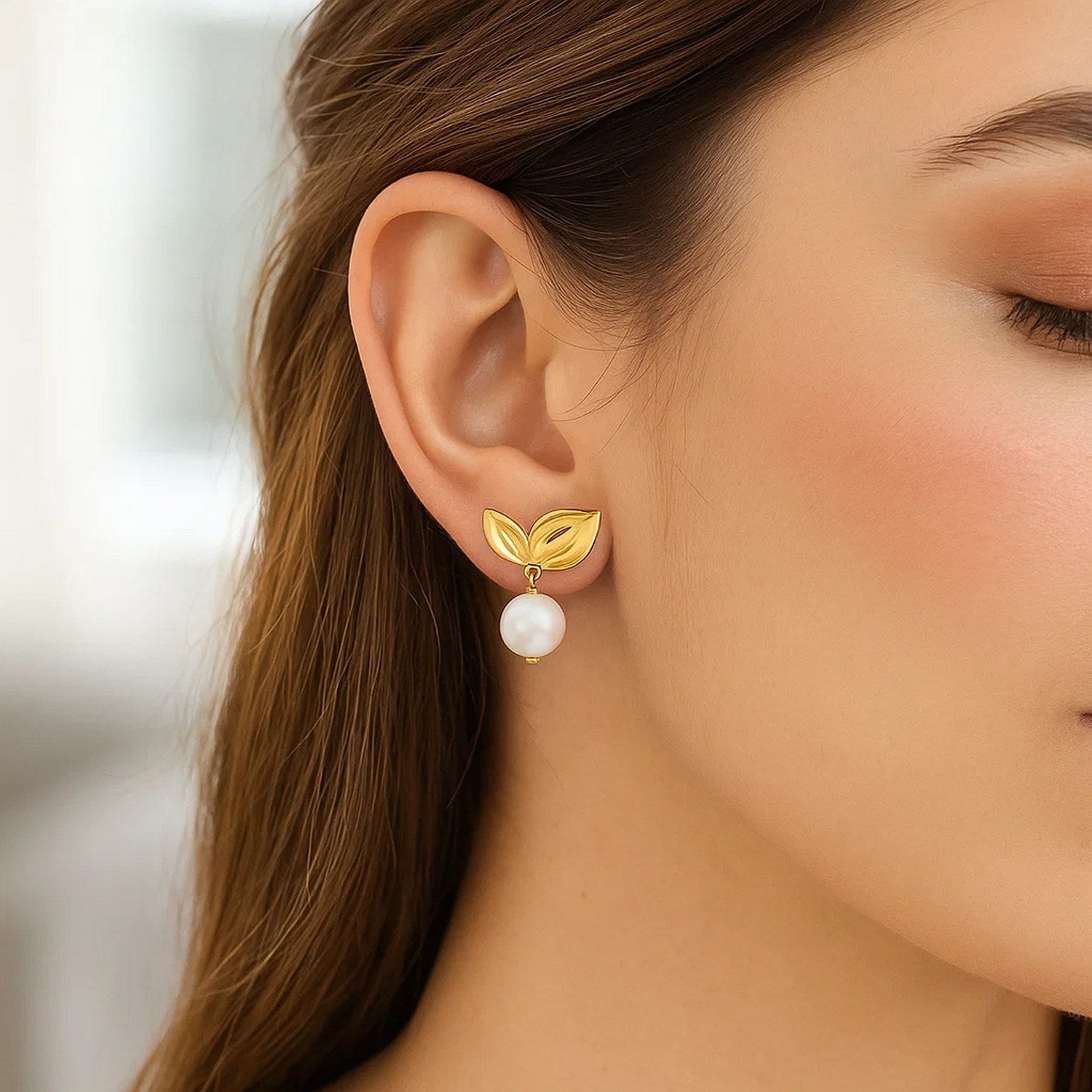 14k yellow gold modern pearl drop earrings adorned with elegant cherry leaf design, showcasing luxury craftsmanship.