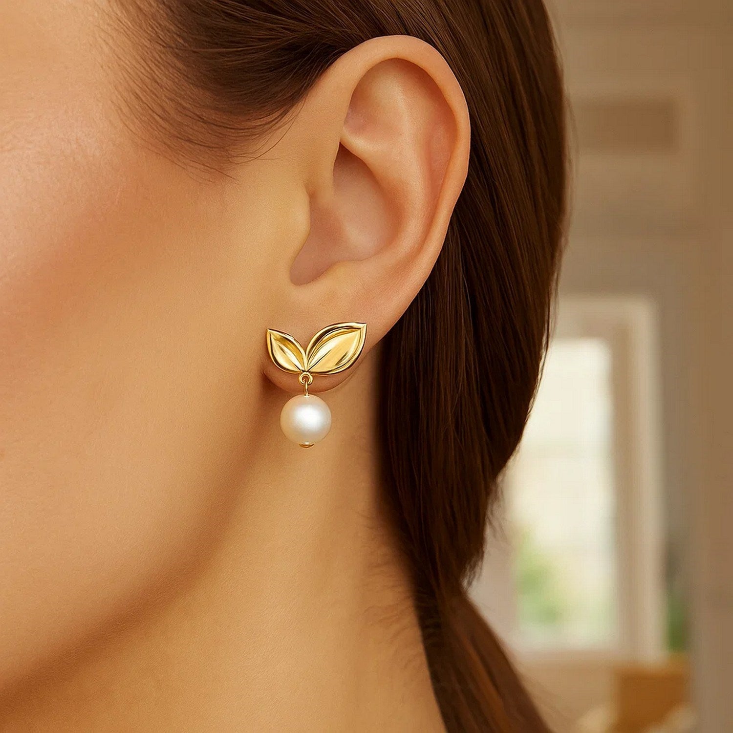 14k yellow gold pearl drop earrings featuring a delicate cherry leaf design for a modern, elegant touch.