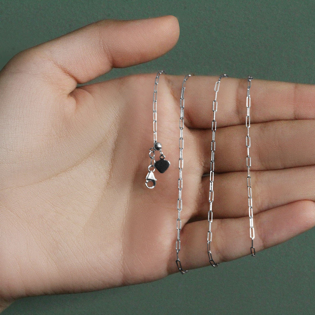 14k white gold adjustable paperclip chain featuring modern links, perfect for layering or standalone elegance.