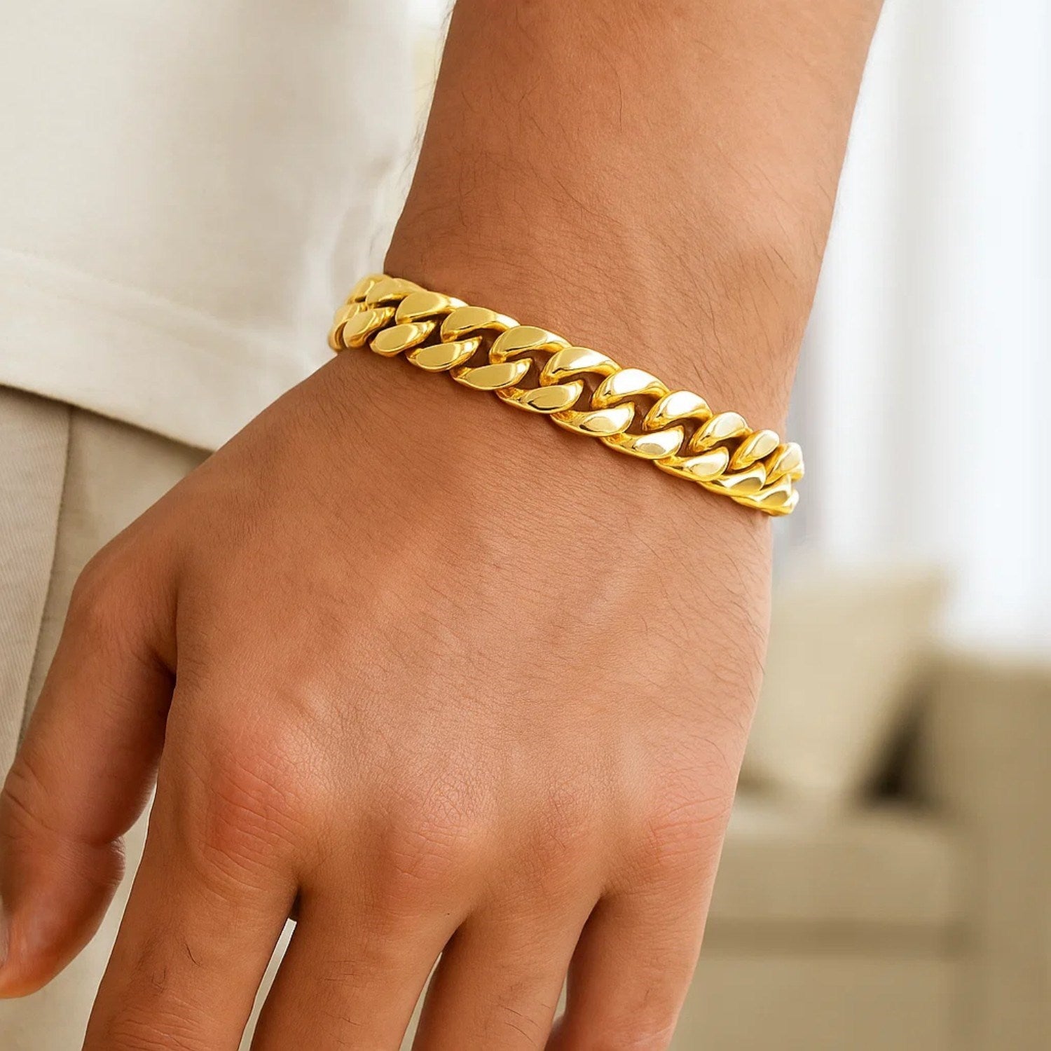 14k yellow gold classic Miami Cuban bracelet with solid links, showcasing timeless elegance and luxurious craftsmanship.