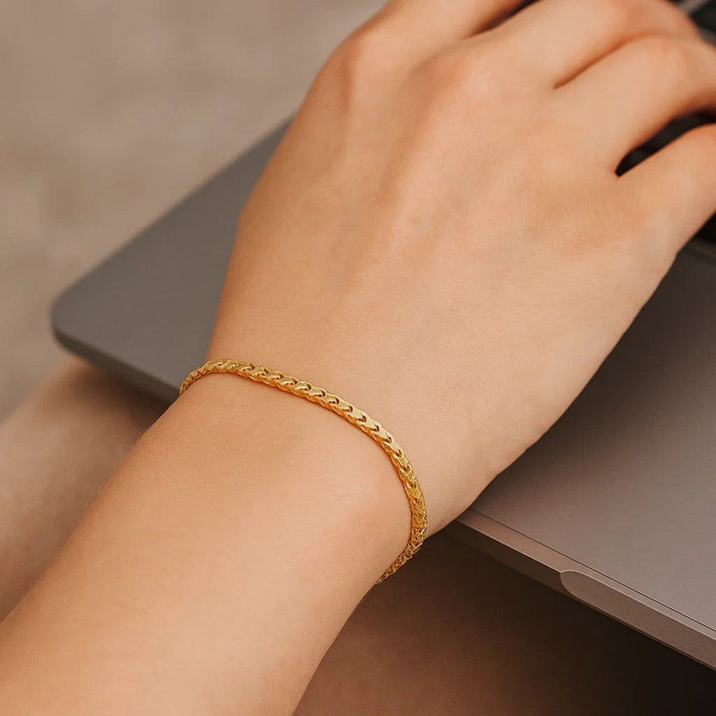14k yellow gold diamond cut round Franco bracelet, elegant chain design, showcasing luxury and craftsmanship.