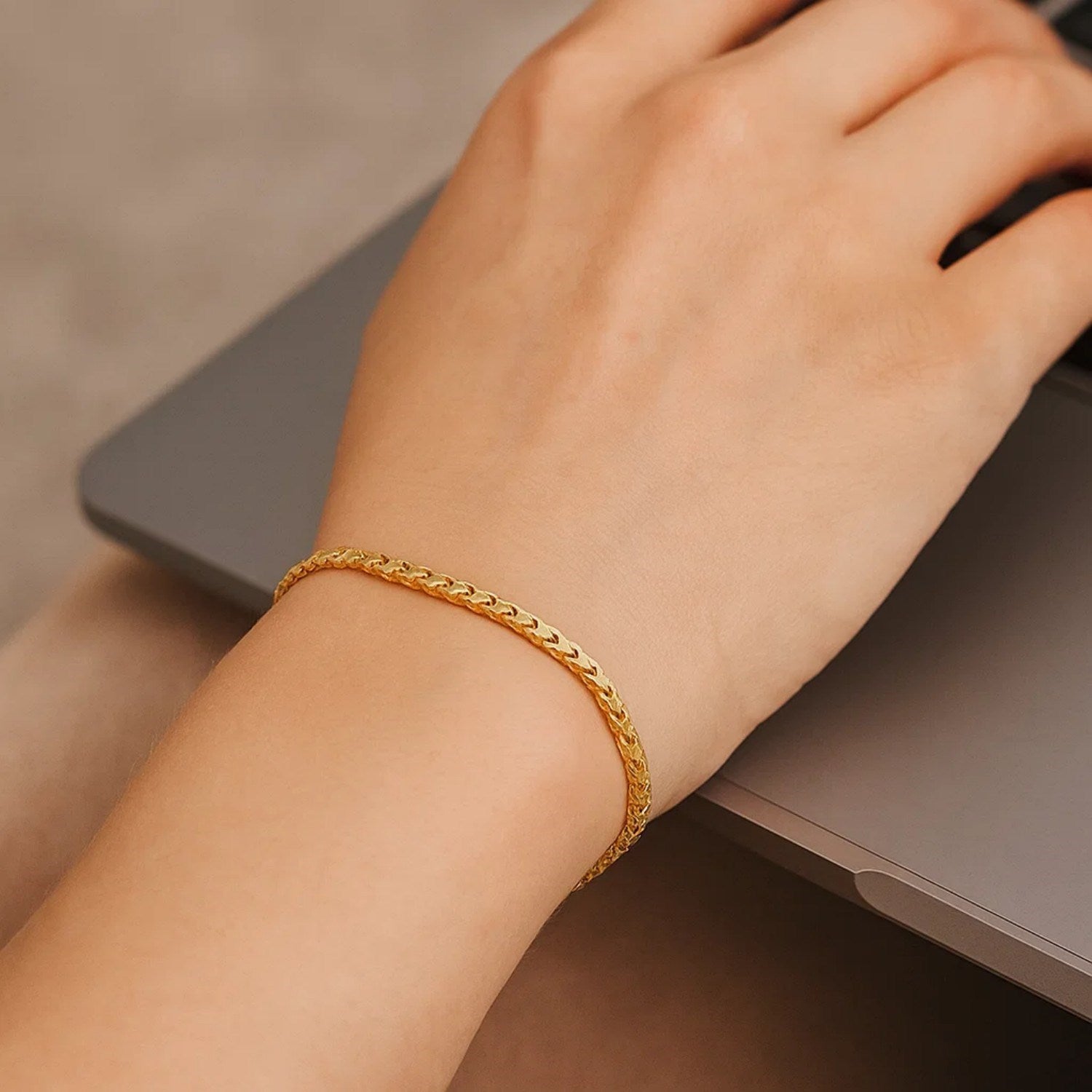 14k yellow gold diamond cut round Franco bracelet, elegant chain design, showcasing luxury and craftsmanship.
