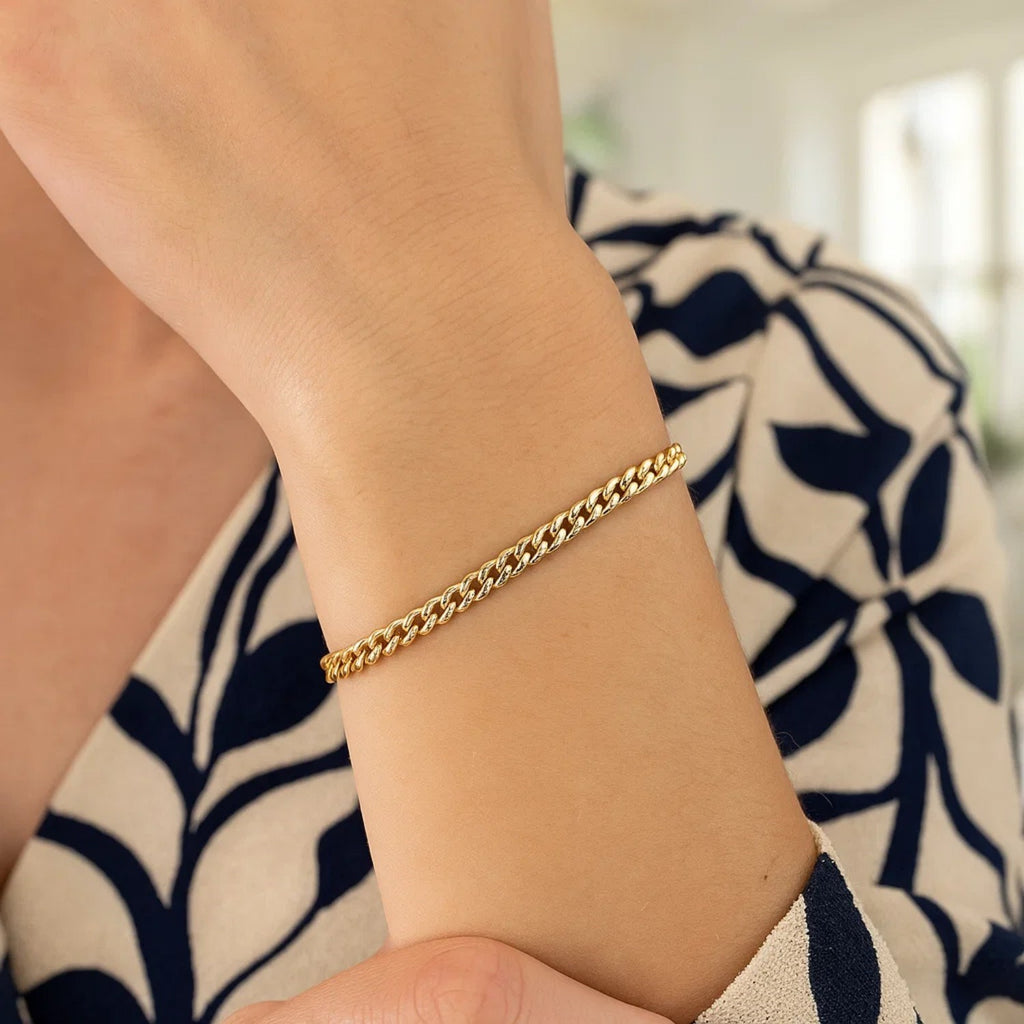 14k yellow gold classic Miami Cuban bracelet featuring solid round links, exuding timeless elegance and luxury.