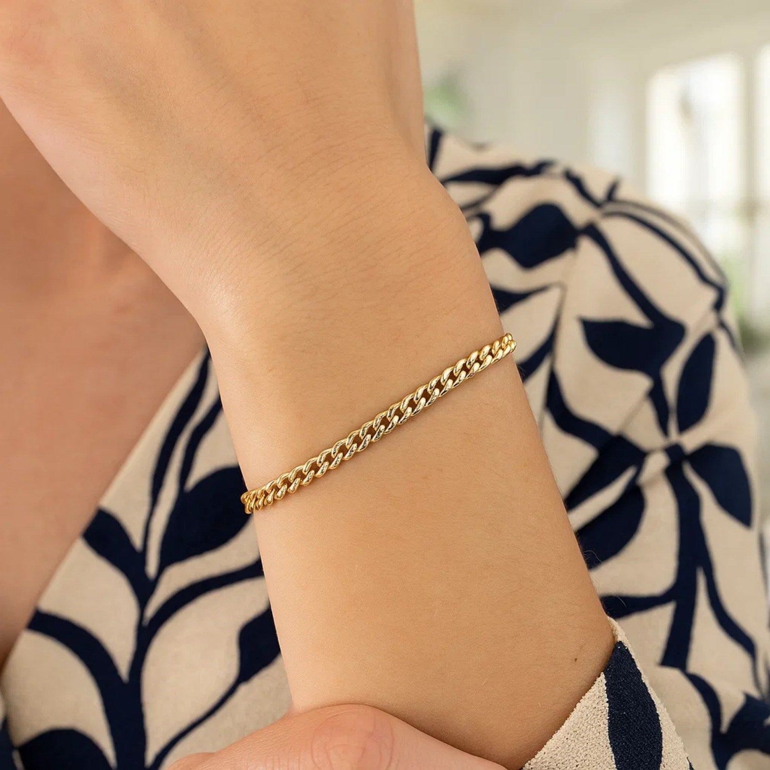 14k yellow gold classic Miami Cuban bracelet featuring solid round links, exuding timeless elegance and luxury.