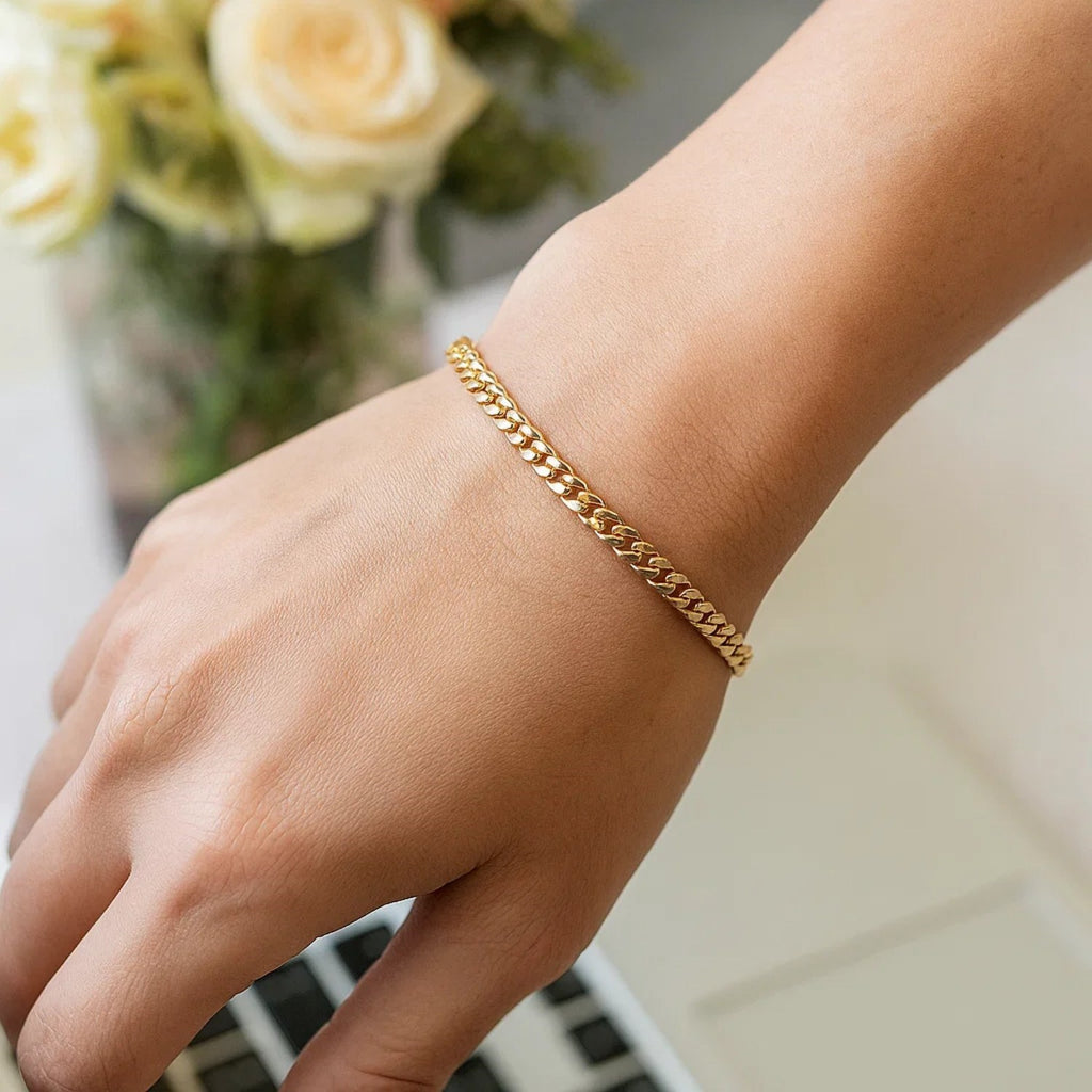 14k yellow gold classic Miami Cuban bracelet with round links, showcasing timeless elegance and luxurious craftsmanship.
