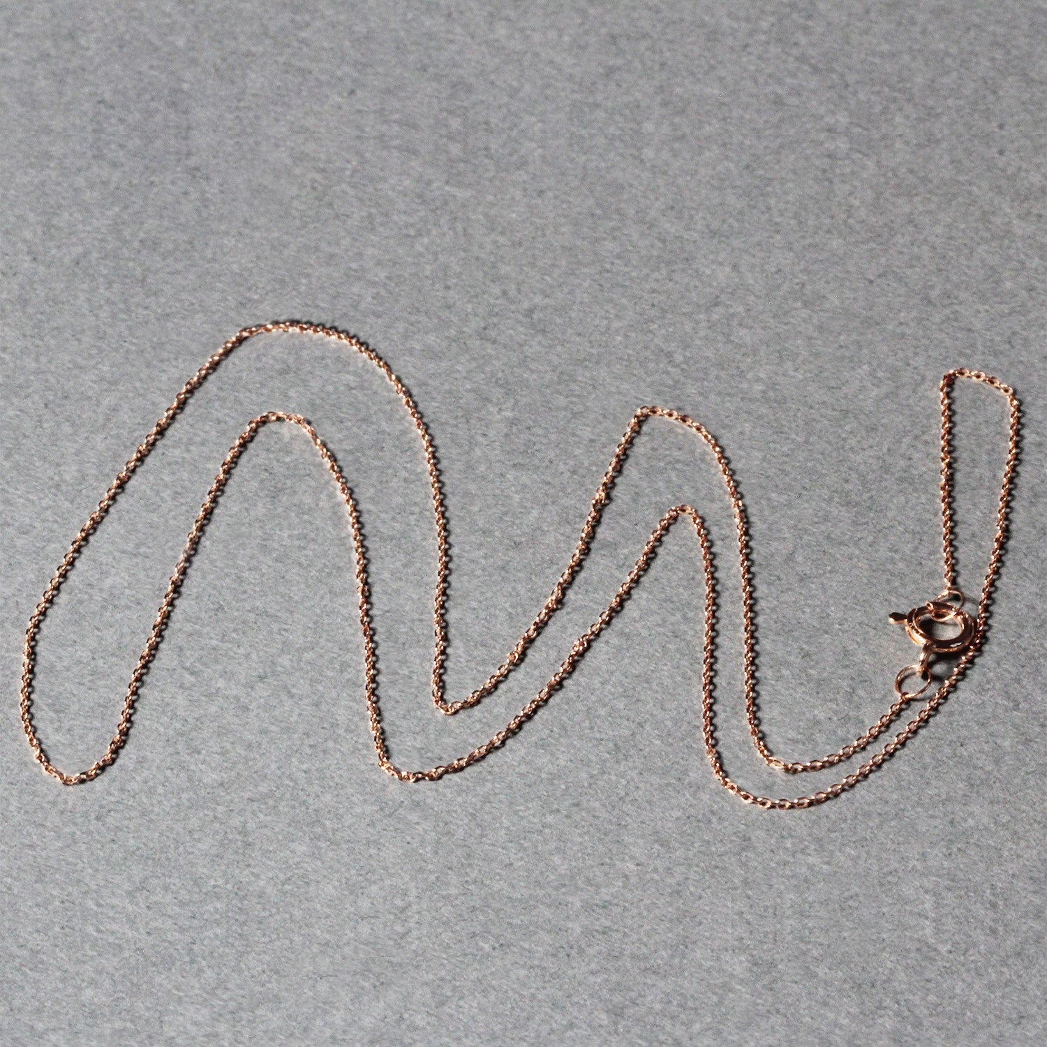 14k rose gold diamond cut cable link chain with modern design, showcasing exquisite craftsmanship and elegance.