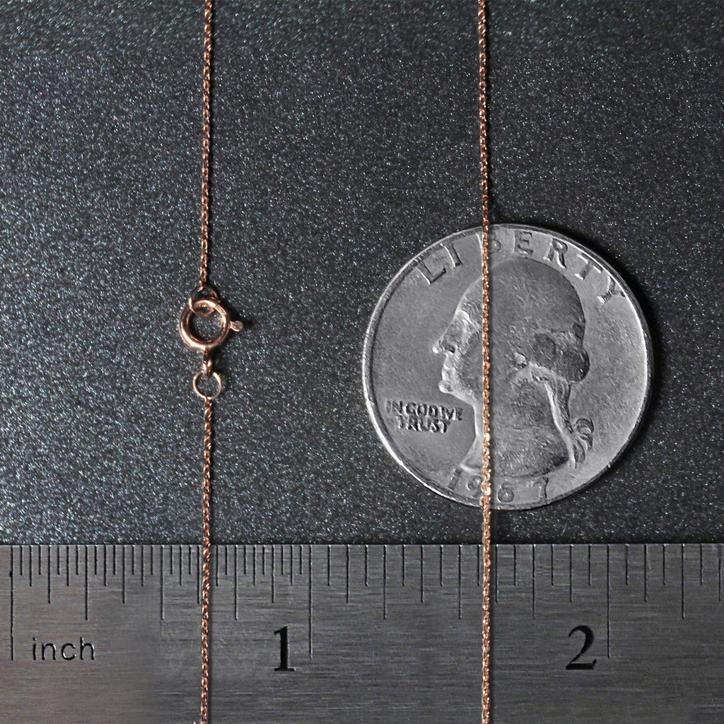 14k rose gold diamond cut cable link chain, modern design, featuring delicate links and a luxurious shine.