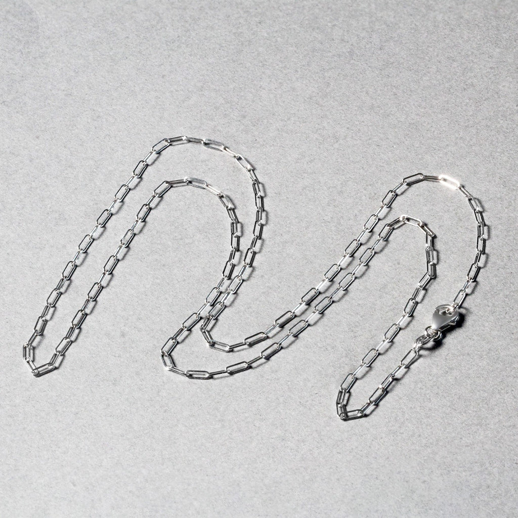 14k white gold fine paperclip chain with modern design, featuring sleek round links for an elegant look.