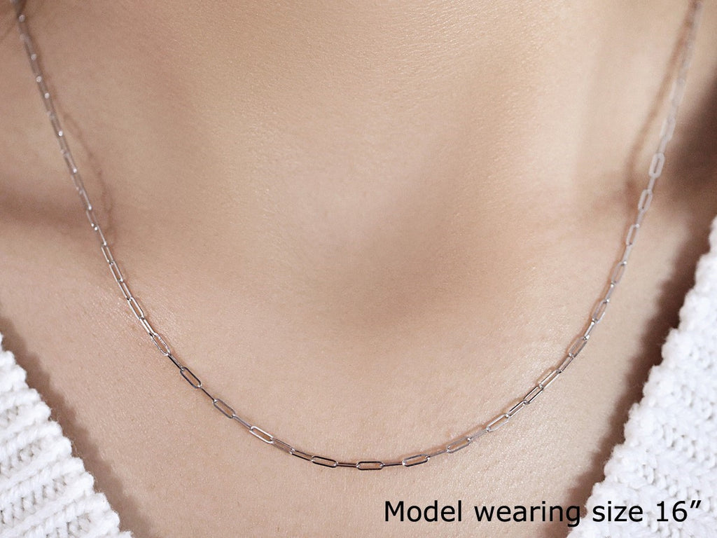 14K white gold fine paperclip chain with a modern design, showcasing elegant round links for a luxurious look.