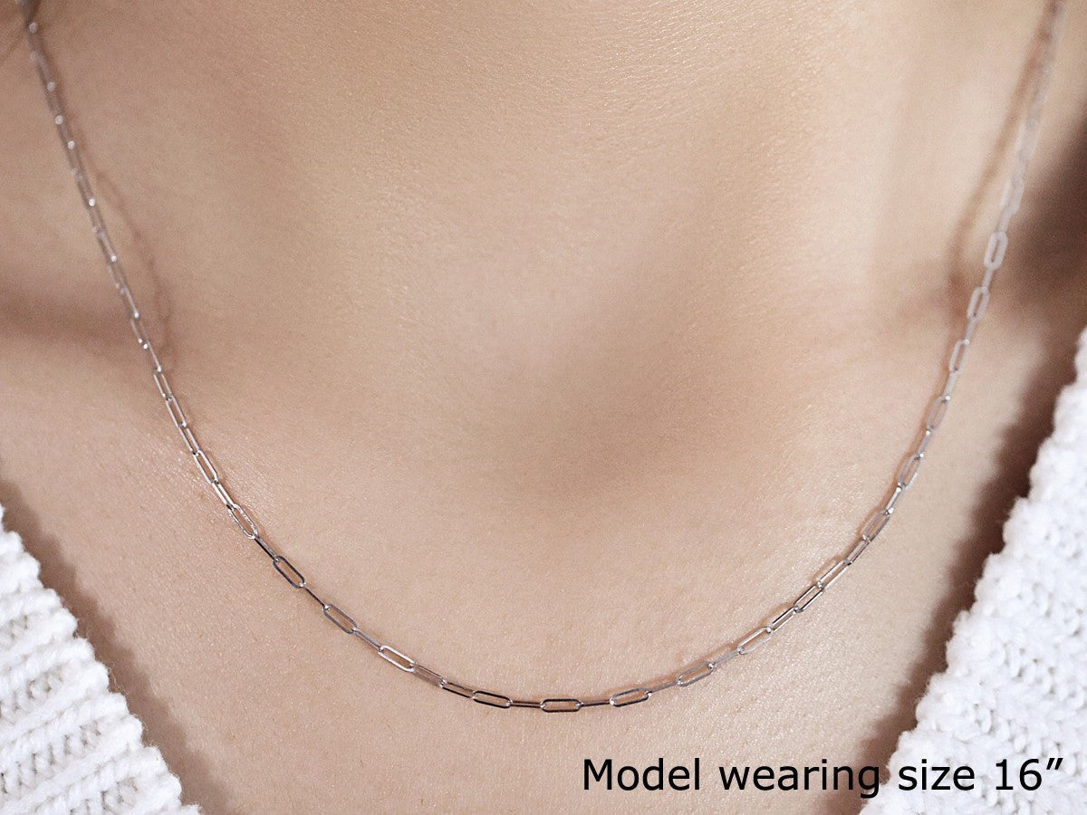 14K white gold fine paperclip chain with a modern design, showcasing elegant round links for a luxurious look.