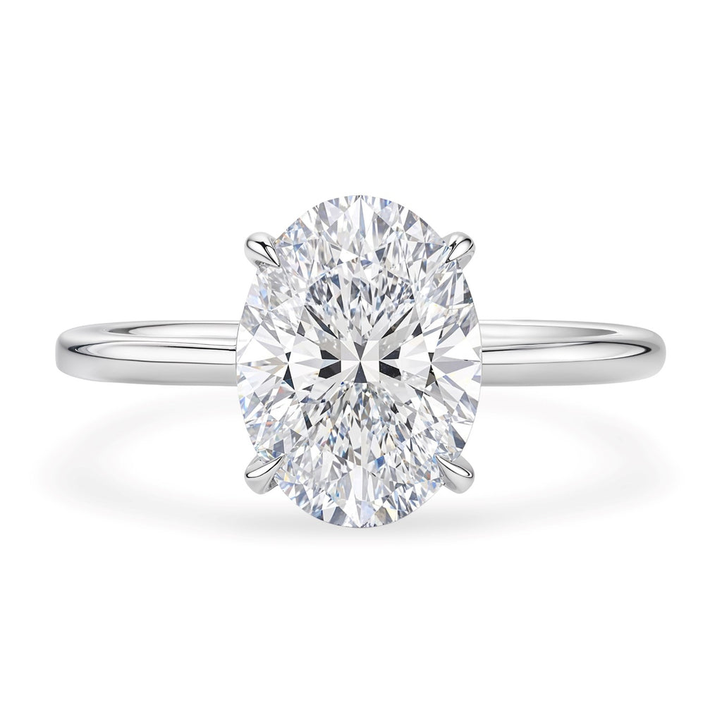 14k white gold solitaire ring featuring a stunning 2 carat oval lab-grown diamond in a classic design.