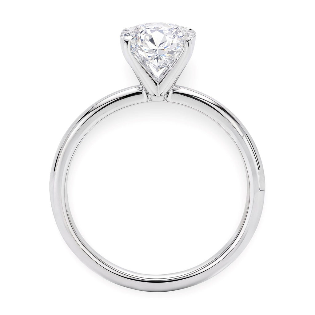 14k white gold solitaire ring featuring a stunning 2 carat oval lab-grown diamond in a classic design.